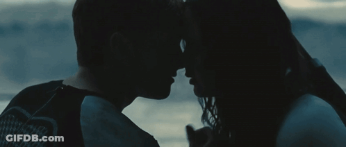 Man And Woman Looking Into Each Other's Eyes In The Dark GIF