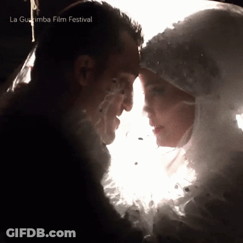 Man And Woman Looking Into Each Other's Eyes La Guajira Film Festival GIF
