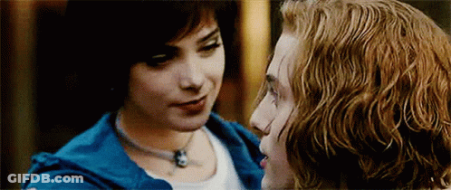 Man And Woman Looking Into Each Other's Eyes Woman In Blue Jacket GIF