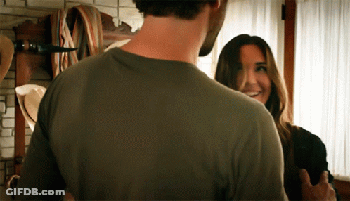 Man And Woman Looking, Woman Smiling GIF