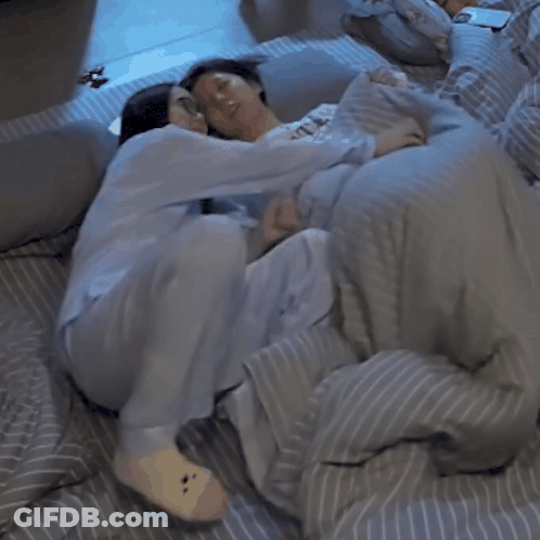 Man And Woman Lying In Bed GIF
