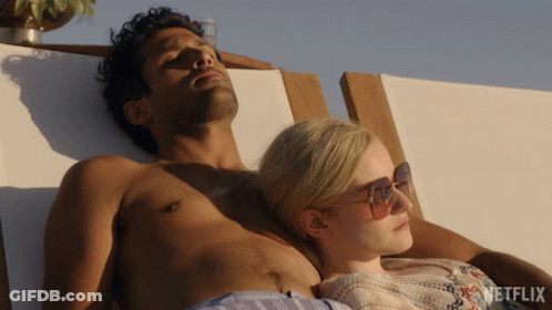 Man And Woman Lying On Beach Chair GIF