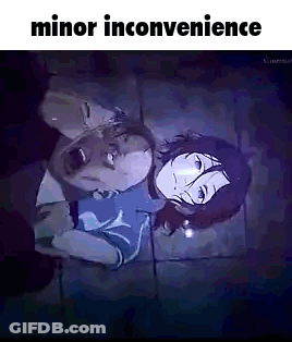 Man And Woman Lying On Tiled Floor In Dark Room GIF