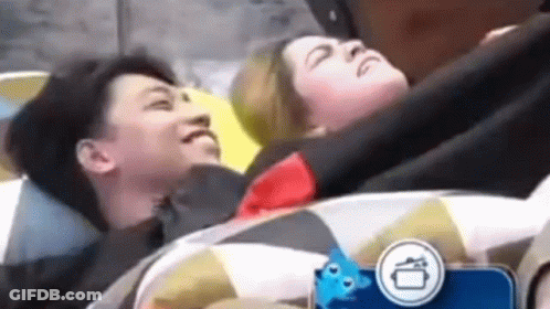 Man And Woman Lying On Top Of Each Other In Bed GIF