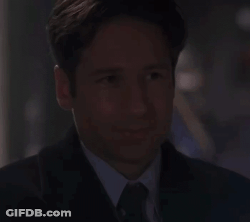Man And Woman Making Funny Faces On Couch GIF