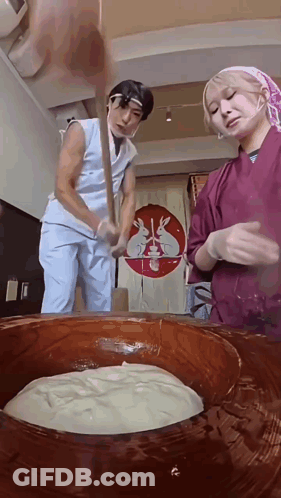 Man And Woman Mixing In Large Bowl GIF