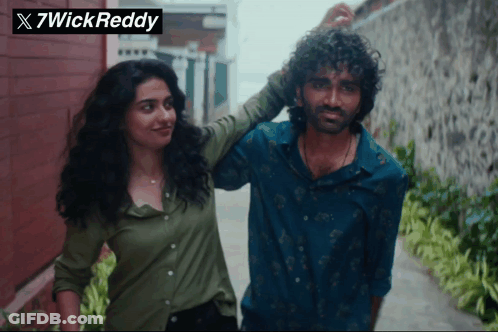 Man And Woman Next To 7Wick Reddy Logo GIF