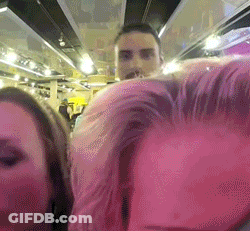 Man And Woman Next To Each Other In Pink Room GIF
