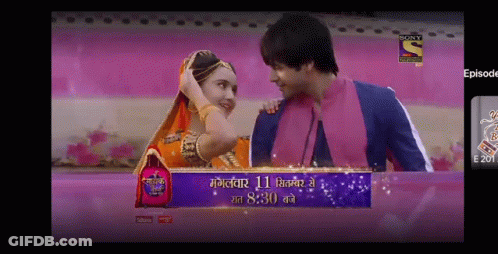 Man And Woman Next To Sony Entertainment GIF