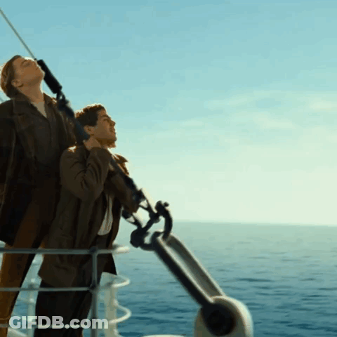 Man And Woman On A Boat In The Ocean GIF
