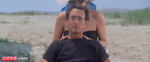Man And Woman On Beach With Jaws GIF