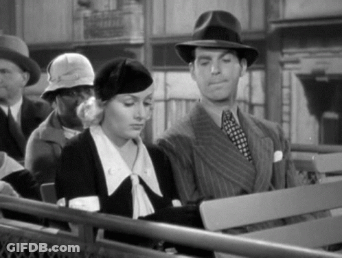 Man And Woman On Bench In Black And White Photo GIF