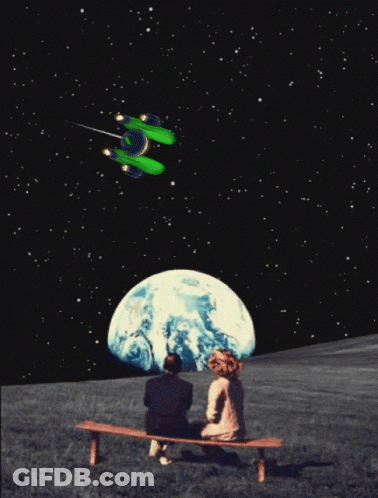 Man And Woman On Bench Watching Green Spaceship Over Earth GIF