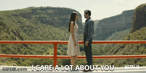 Man And Woman On Bridge Saying I Care A Lot About You GIF