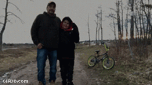 Man And Woman On Dirt Road GIF