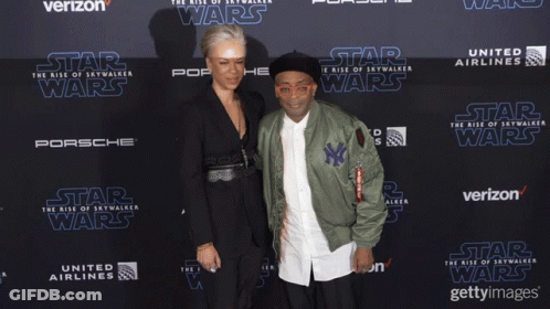 Man And Woman On Red Carpet For Star Wars GIF