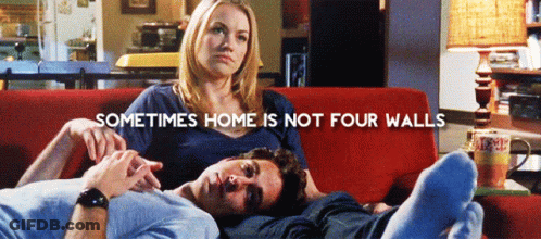 Man And Woman On Red Couch With Sometimes Home Is Not Four Walls GIF