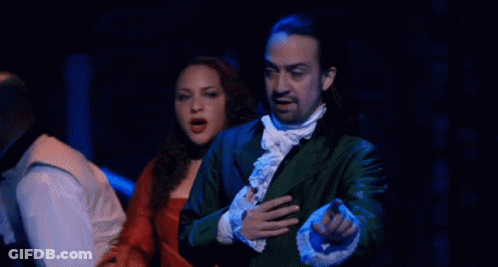 Man And Woman On Stage Man In Green Jacket And Tie GIF
