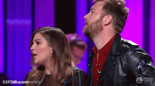 Man And Woman On Stage Man In Leather Jacket GIF