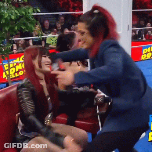 Man And Woman On Stage With Belt Saying Next Thing GIF