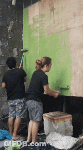 Man And Woman Painting Green Wall GIF