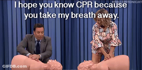 Man And Woman Performing CPR On Mannequin GIF