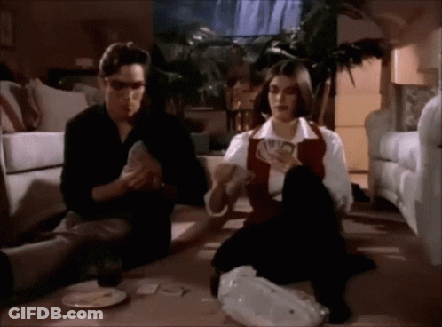 Man And Woman Playing Cards GIF