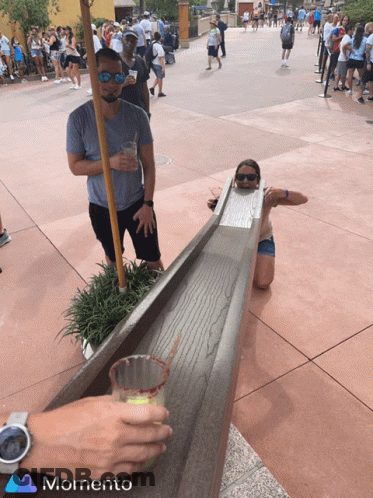 Man And Woman Playing Game With Memento Logo GIF