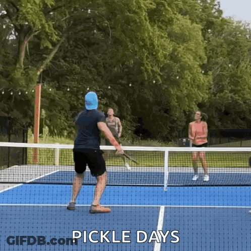 Man And Woman Playing Pickleball GIF