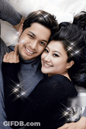 Man And Woman Posing And Smiling GIF