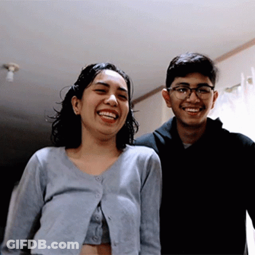 Man And Woman Posing And Smiling GIF