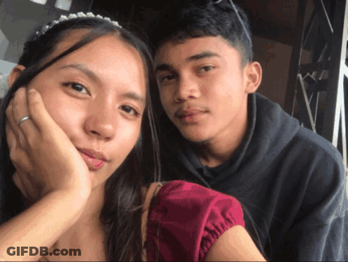 Man And Woman Posing For Photo GIF