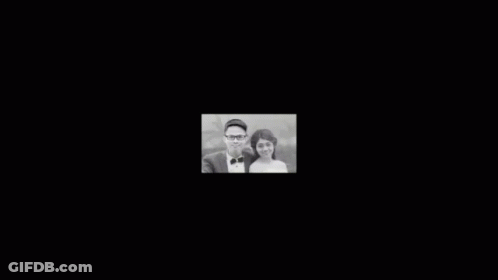 Man And Woman Posing For Photo GIF