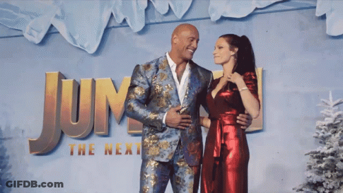 Man And Woman Posing In Front Of Jump Sign GIF