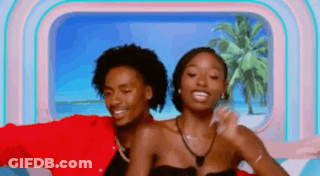 Man And Woman Posing In Front Of Window GIF