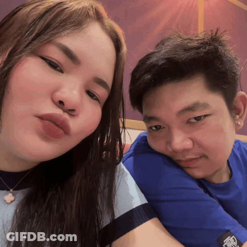 Man And Woman Posing, Man In Blue Shirt With Vans GIF