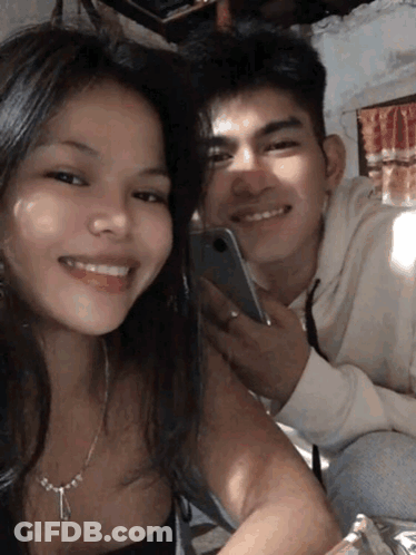 Man And Woman Posing Necklace GIF