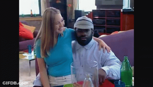 Man And Woman Posing On Couch GIF