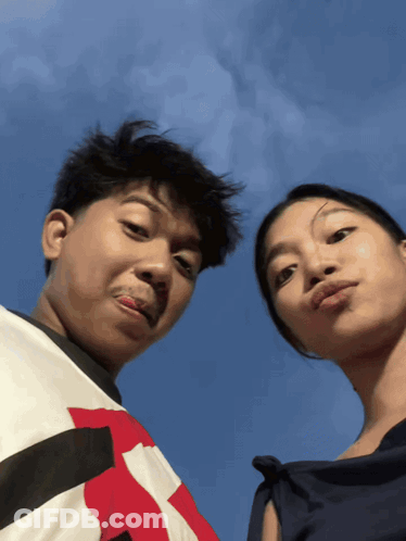 Man And Woman Posing, Shirt With Letter R GIF