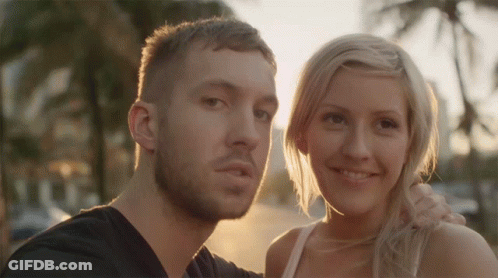 Man And Woman Posing Smiling GIF