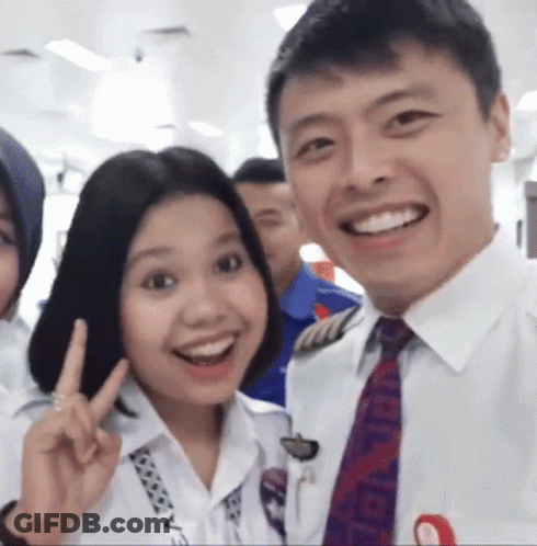 Man And Woman Posing With Chanel Tie GIF