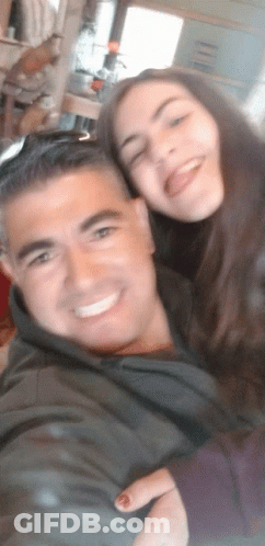 Man And Woman Posing With Tongue Out GIF