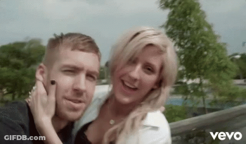 Man And Woman Posing With Vevo GIF