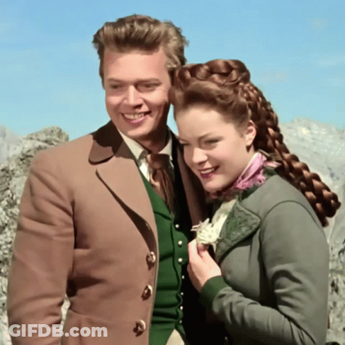 Man And Woman Posing Woman In Green Jacket GIF