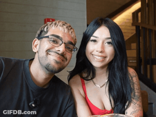 Man And Woman Posing Woman In Red Top GIF