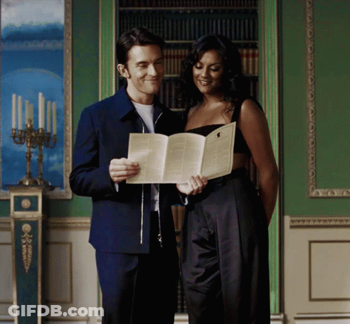 Man And Woman Reading Book Together GIF