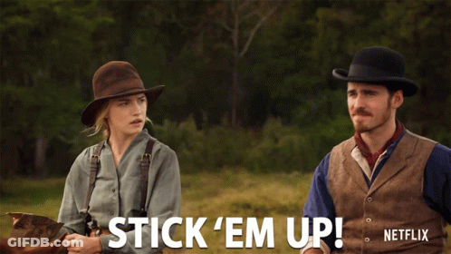 Man And Woman Riding Horses Saying Stick Em Up GIF
