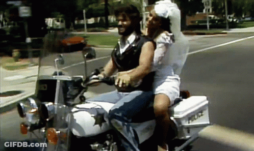 Man And Woman Riding Motorcycle With Police Box GIF