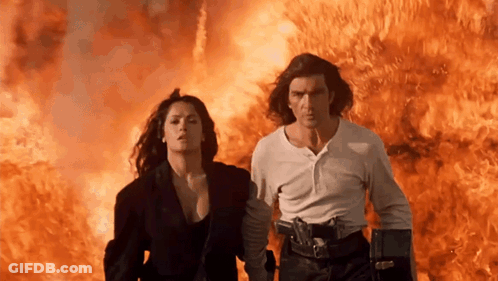 Man And Woman Running From Fire GIF