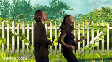 Man And Woman Running In Front Of Picket Fence GIF